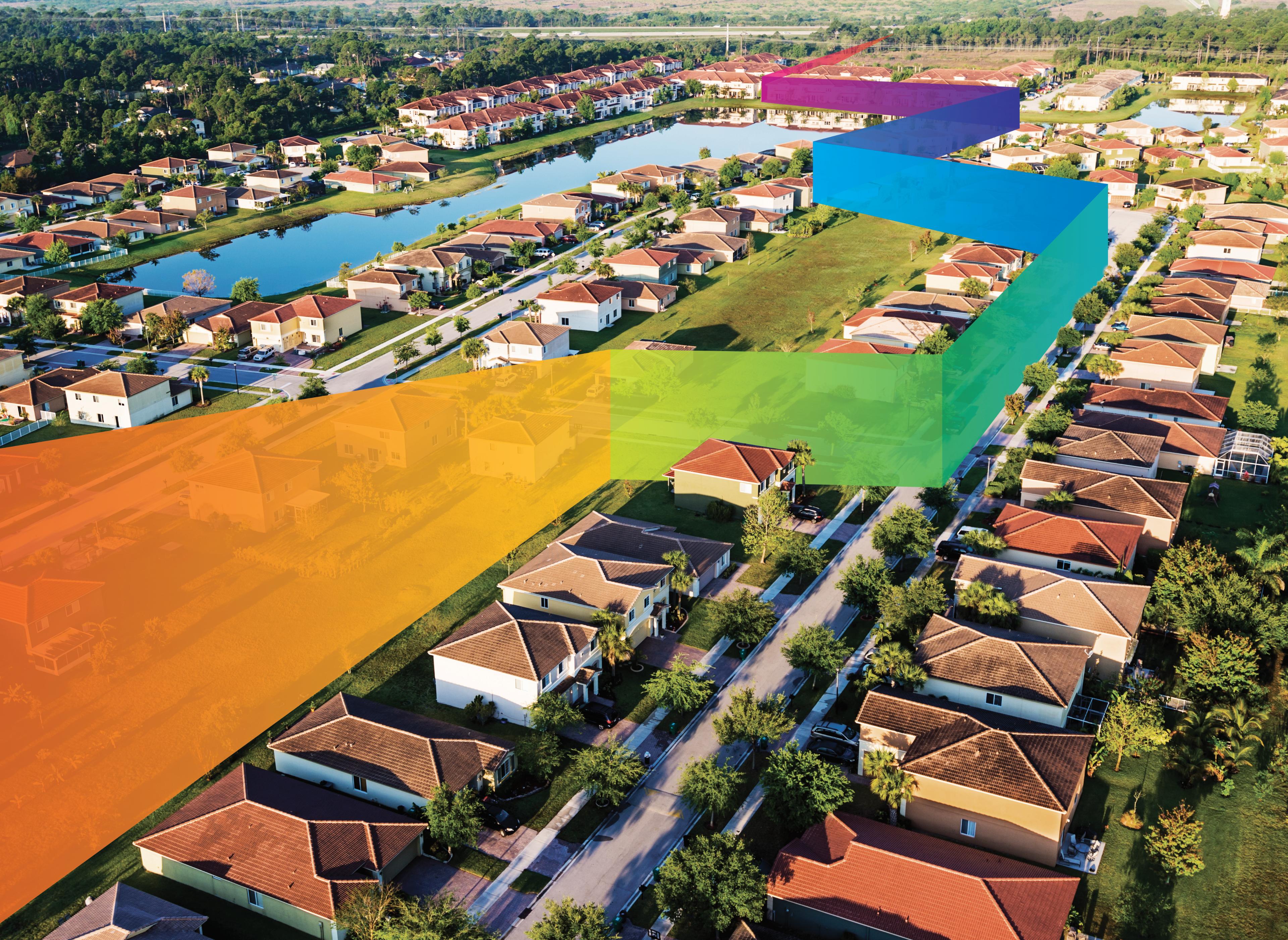 Luftaufnahme eines Wohngebiets mit farbigen Bändern (Orange, Gelb, Grün, Blau und Lila), die über die Häuser verlaufen und die Glasfaserinfrastruktur oder Netzwerkverbindungen von CommScope symbolisieren.